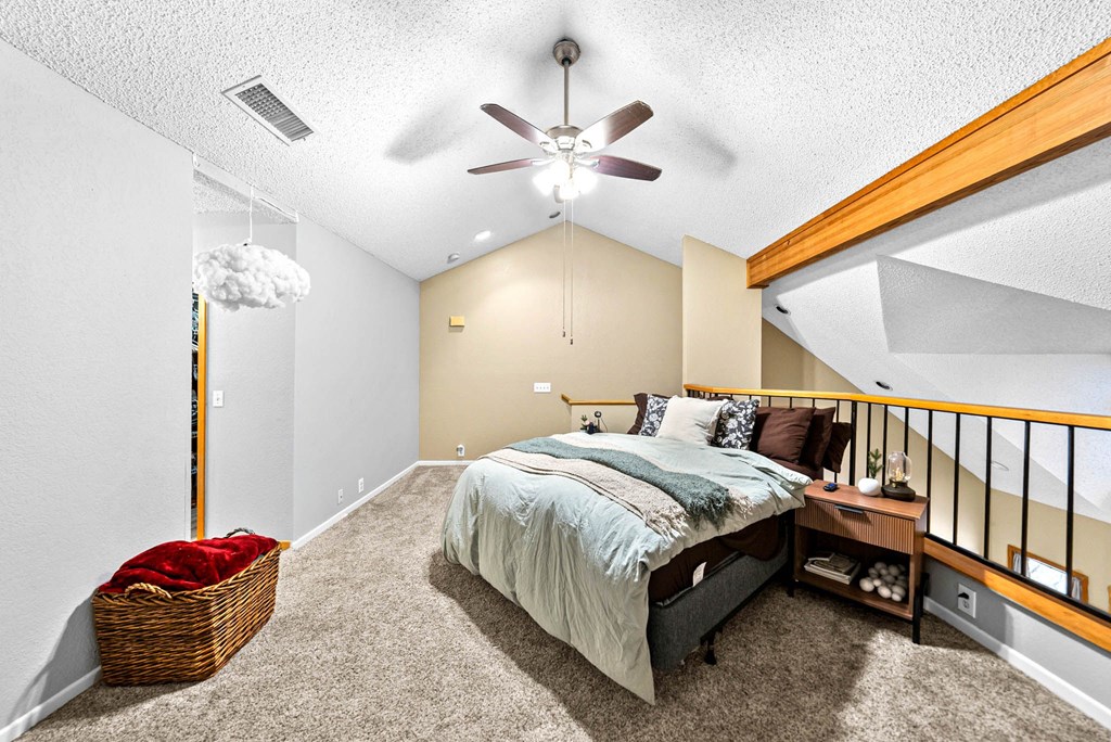 805-119 Highway 534 Loop Kerrville, TX 78028 - Photo 15 of 23 a bedroom with a bed and a chandelier