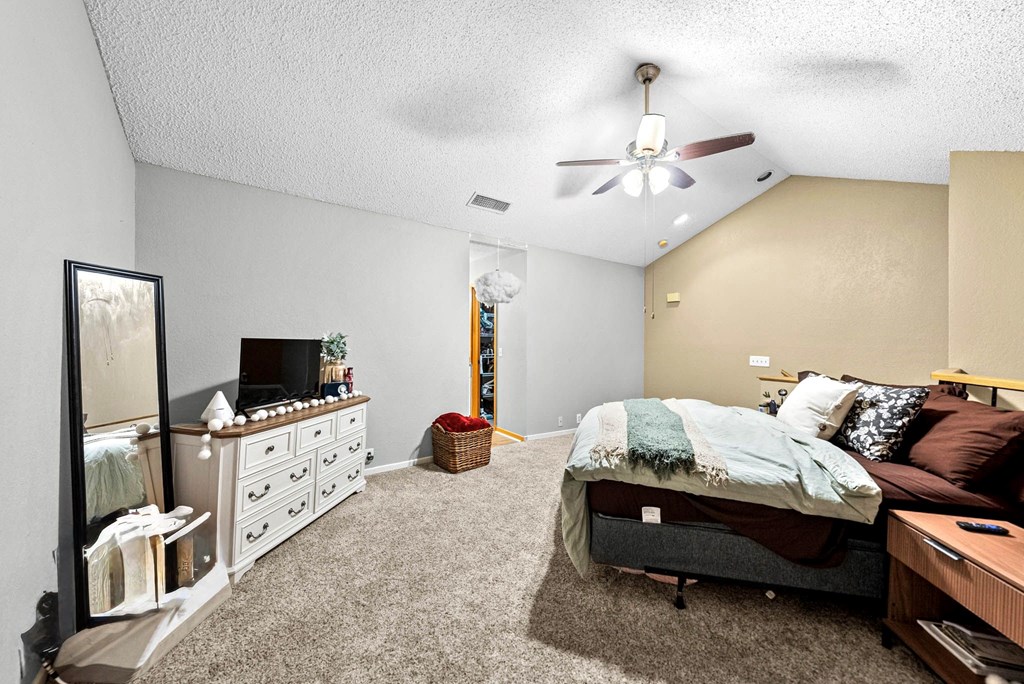 805-119 Highway 534 Loop Kerrville, TX 78028 - Photo 16 of 23 a bedroom with furniture and flat screen tv