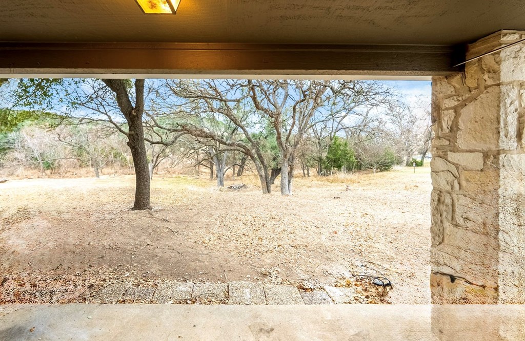 805-119 Highway 534 Loop Kerrville, TX 78028 - Photo 19 of 23 a view of roof with tree in the background