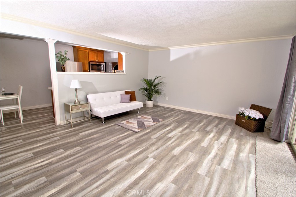 3064 Panorama Road, Unit C Riverside, CA 92506 - Photo 1 of 1 a bedroom with a bed and wooden floor