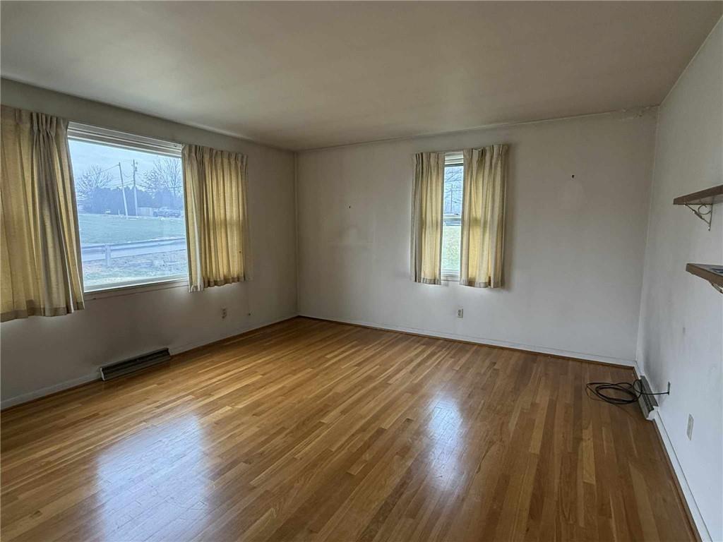 359 Dixon Boulevard Uniontown, PA 15401 - Photo 2 of 21 a view of an empty room with wooden floor and a window