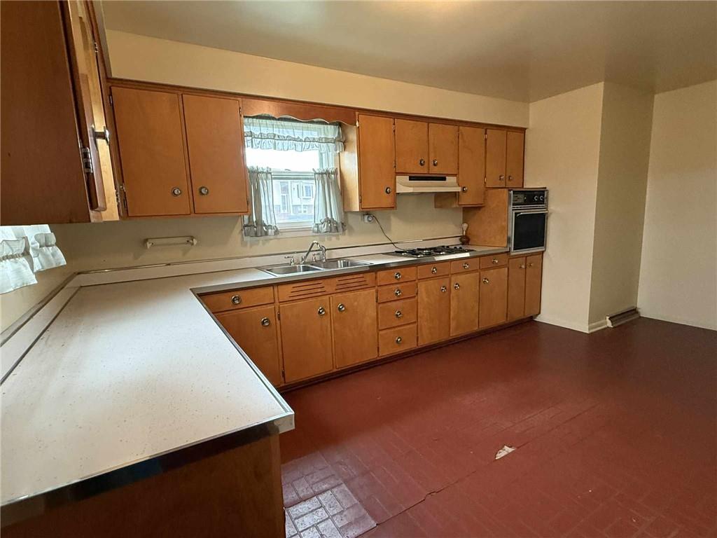 359 Dixon Boulevard Uniontown, PA 15401 - Photo 5 of 21 a kitchen with stainless steel appliances granite countertop a sink stove and refrigerator