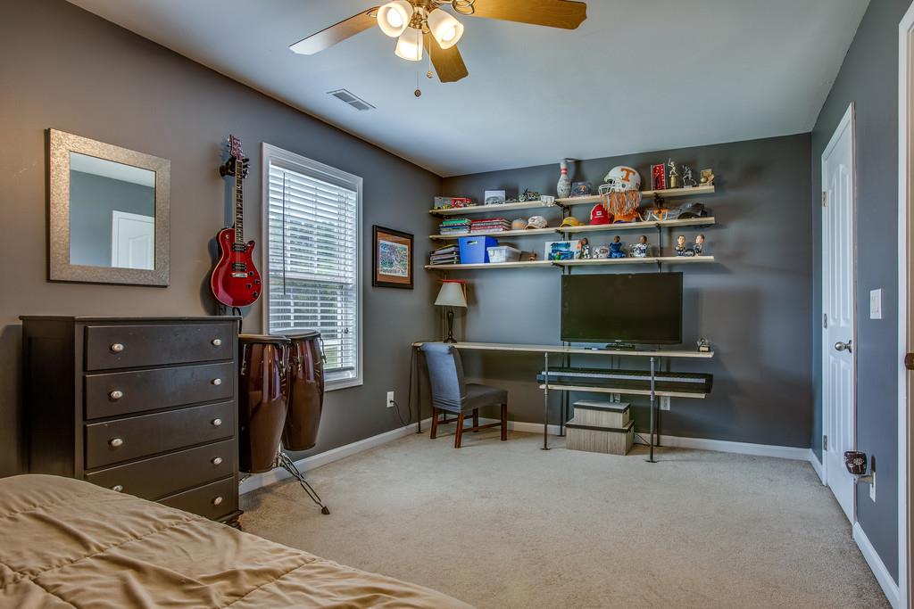 14082 Mt Pleasant Road Rockvale, TN 37153 - Photo 19 of 30 a bedroom with a bed and a bookshelf