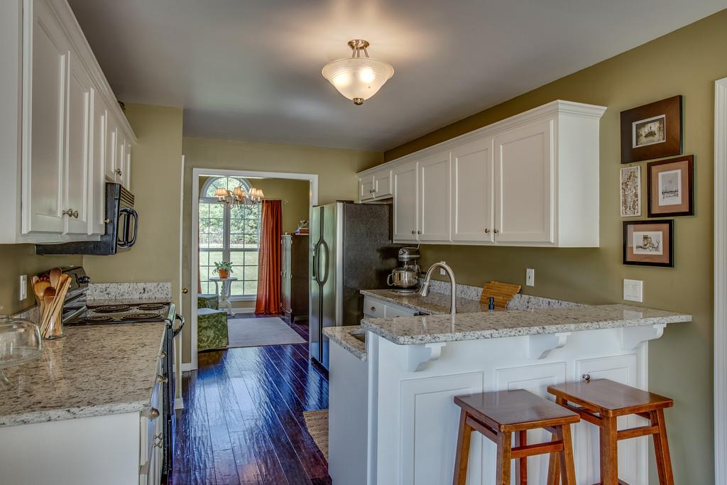 14082 Mt Pleasant Road Rockvale, TN 37153 - Photo 10 of 30 a kitchen with sink a refrigerator and cabinets