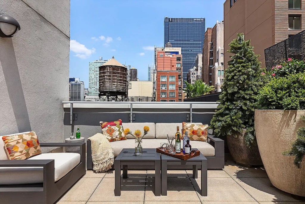 261 West 28th Street, Unit 10D Manhattan, NY 10001 - Photo 5 of 19 a outdoor living room with furniture and a potted plant