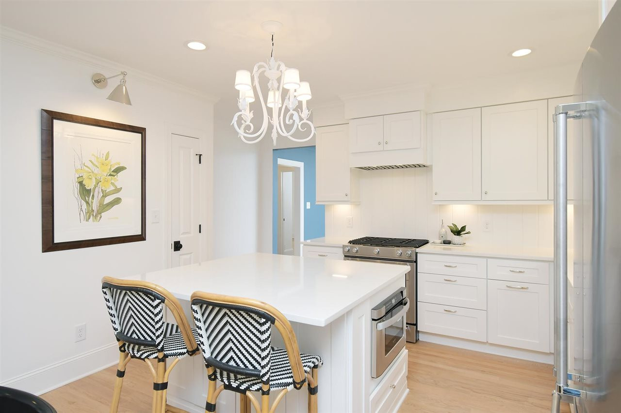 2017 Pine Drive Raleigh, NC 27608 - Photo 6 of 25 a kitchen that has a cabinets and a stove