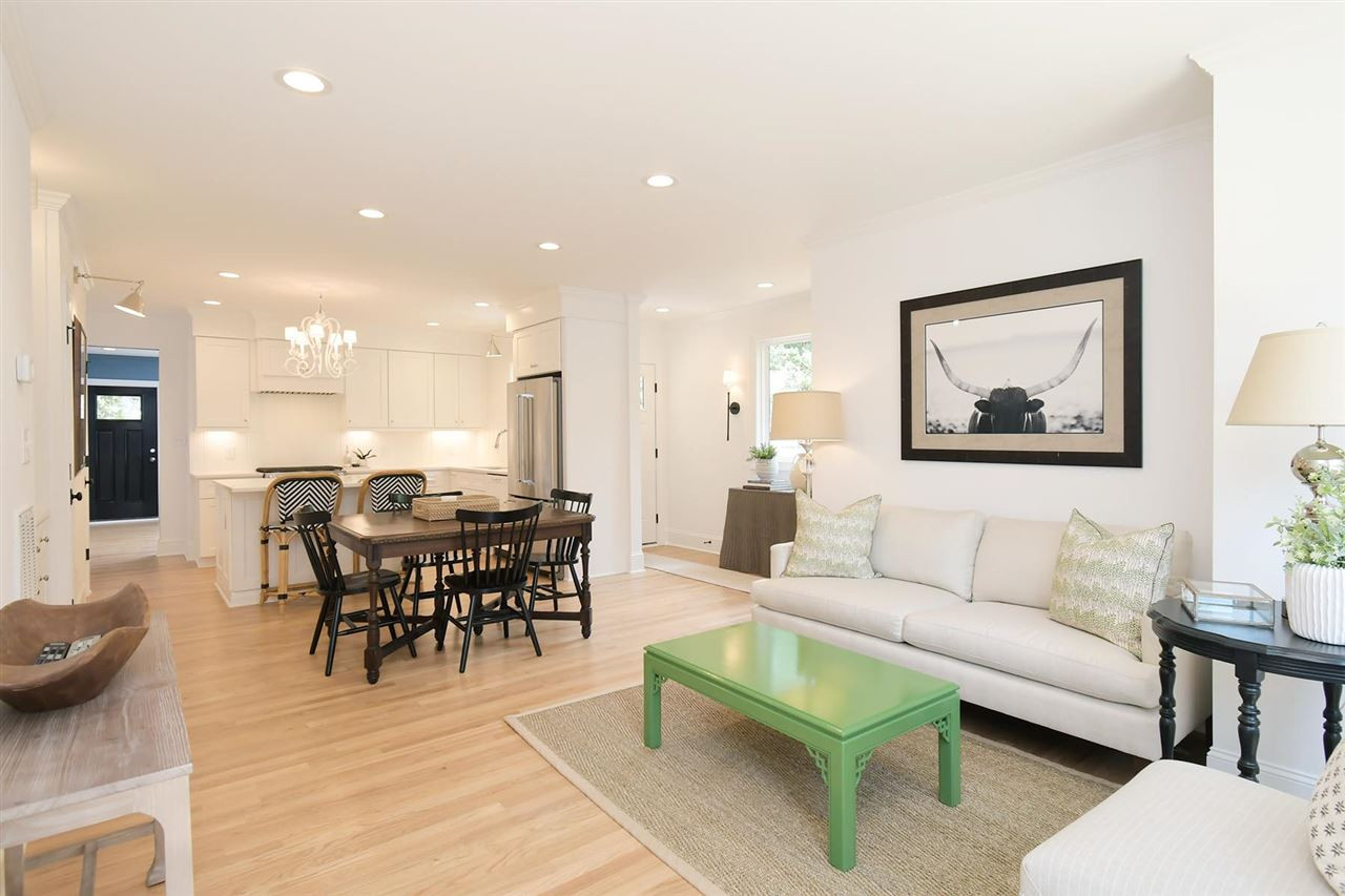 2017 Pine Drive Raleigh, NC 27608 - Photo 10 of 25 a living room with furniture a dining table and kitchen view