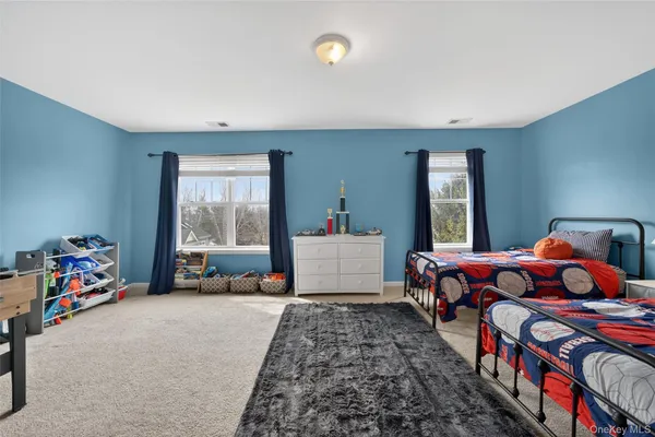 a bedroom with bed and a window