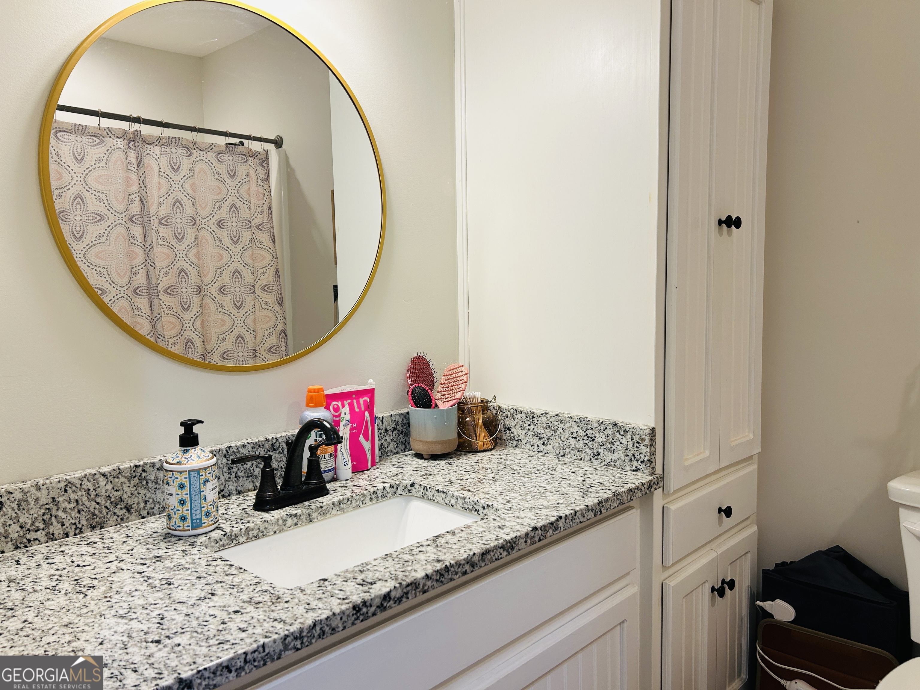 3077 Alec Mountain Road Clarkesville, GA 30523 - Photo 20 of 35 a bathroom with a granite countertop sink and a mirror