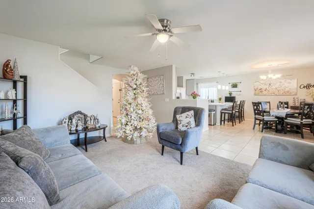 a kitchen with a sink and chairs