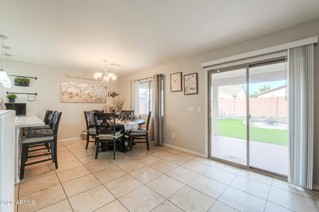 a kitchen with cabinets stainless steel appliances and a window