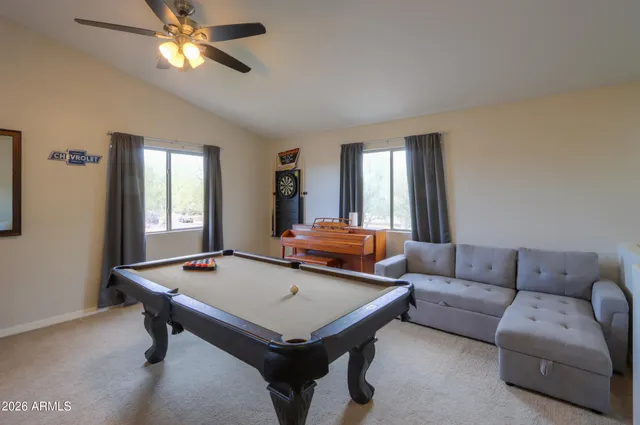 a kitchen with a stove top oven and refrigerator