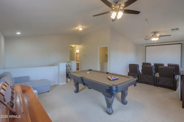 a bathroom with a sink a mirror and a potted plant