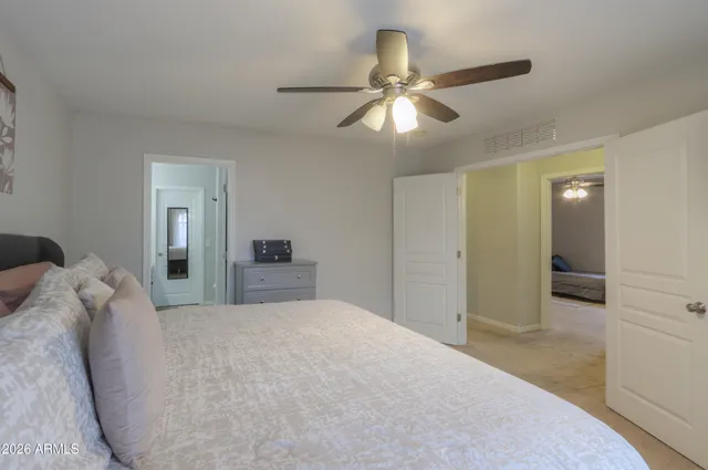 a bedroom with a bed and a fireplace