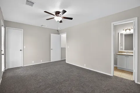 a view of an empty room with a bathroom