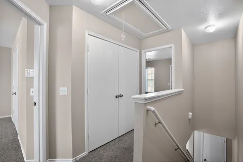 a view of an entryway with wooden floor