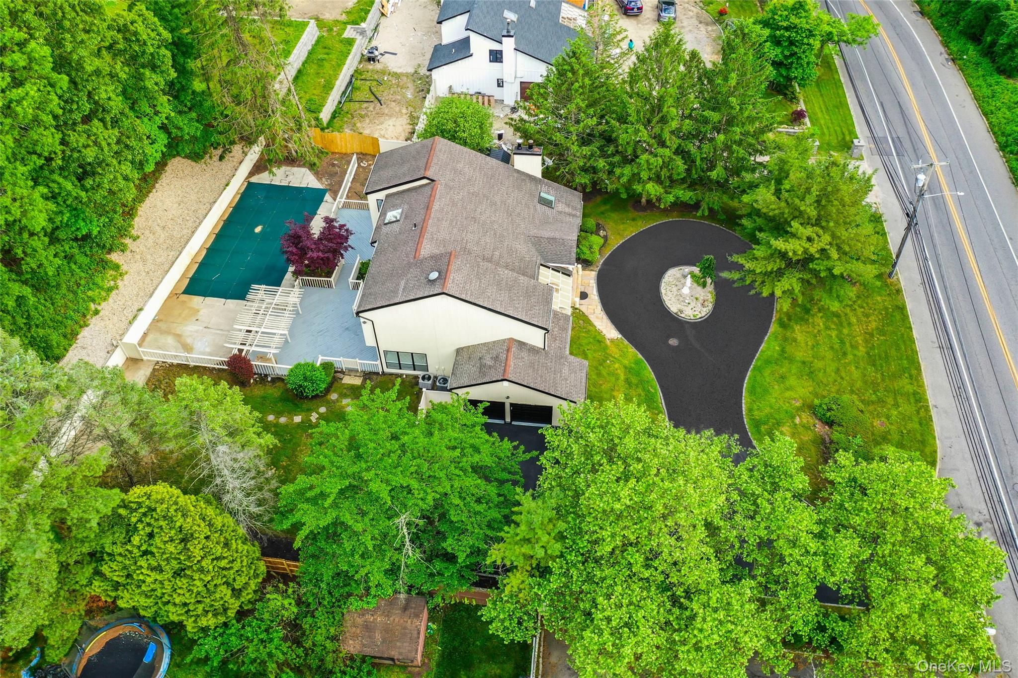 126 Bagatelle Road Melville, NY 11747 - Photo 7 of 50 an aerial view of a house with garden space and street view