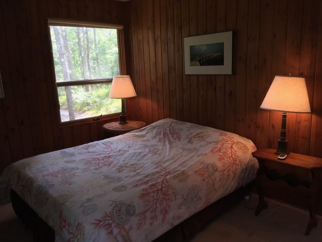 1080 Browns Neck Road Wellfleet, MA 02667 - Photo 30 of 35 a bedroom with a bed and a window
