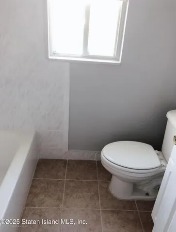 a bathroom with a toilet