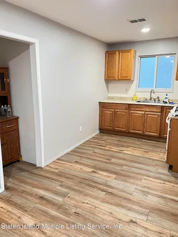 a room with a sink and a mirror