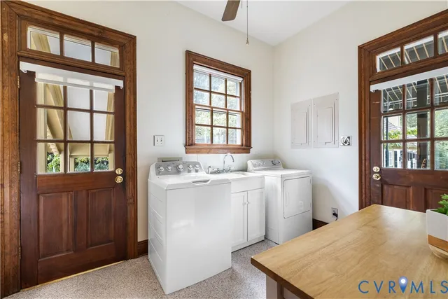 a room with a stove a sink dishwasher and a window