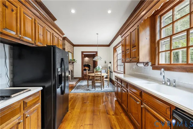 a view of a kitchen with a sink and dishwasher
