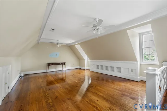 a view of an entryway with a table and chair