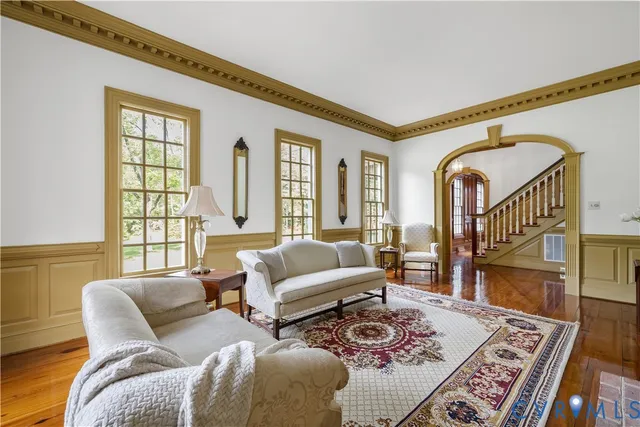 a living room with furniture and a rug