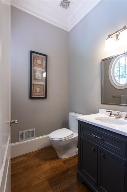 165 Autry Trail Alpharetta, GA 30022 - Photo 22 of 70 a bathroom with a toilet a sink and mirror