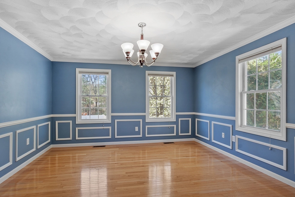107 Charant Road Lowell, MA 01854 - Photo 11 of 30 a view of a livingroom with a chandelier