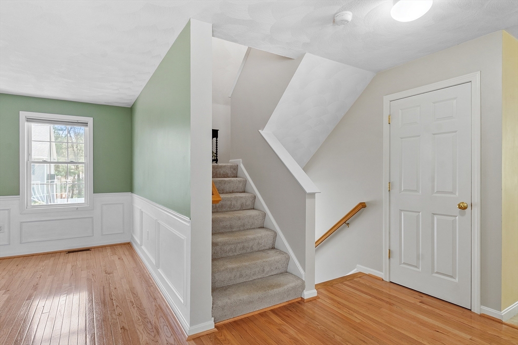 107 Charant Road Lowell, MA 01854 - Photo 12 of 30 a view of entryway with wooden floor and stair