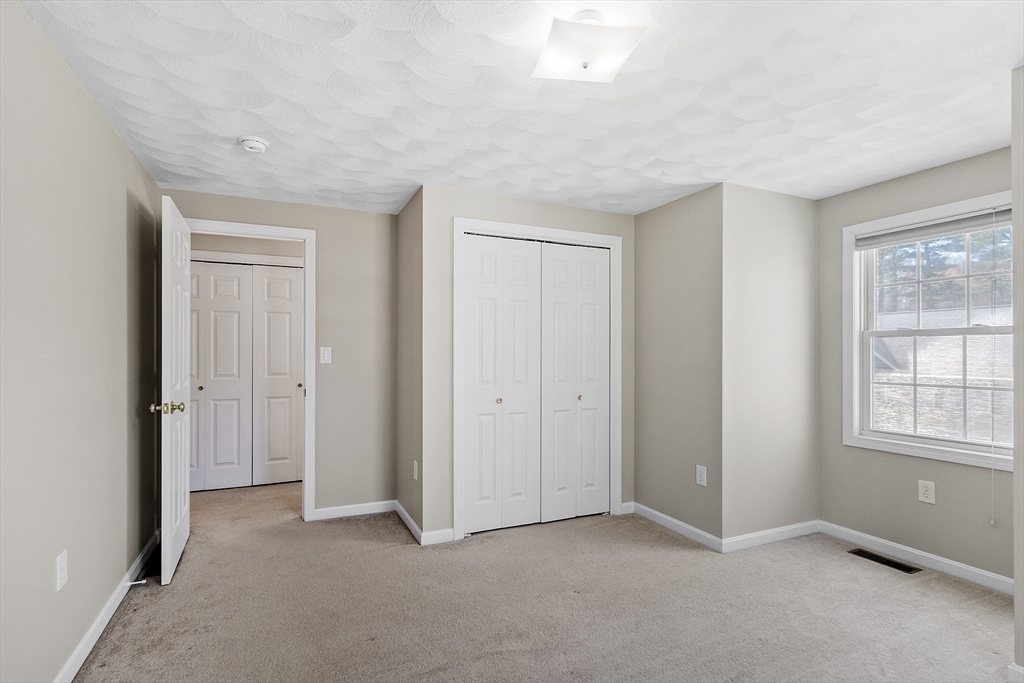 107 Charant Road Lowell, MA 01854 - Photo 13 of 30 a view of an empty room with a window