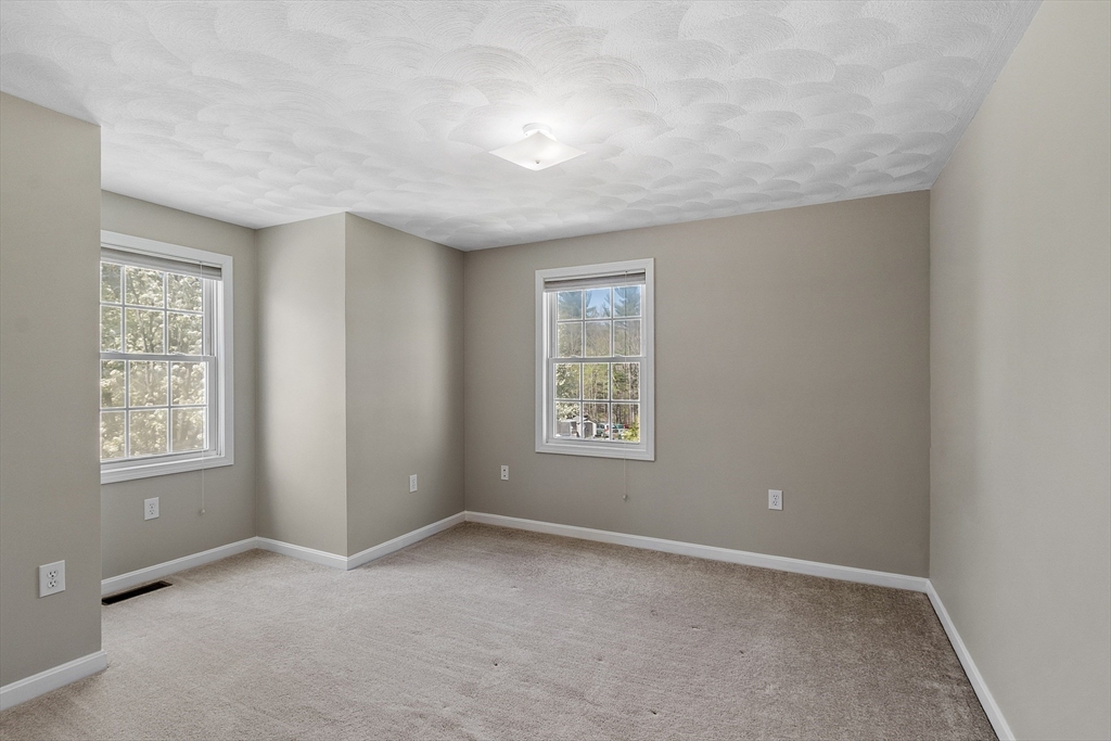 107 Charant Road Lowell, MA 01854 - Photo 14 of 30 an empty room with windows