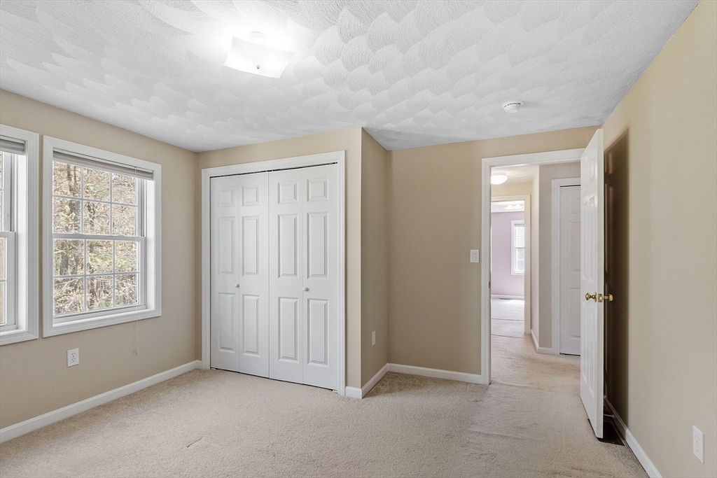 107 Charant Road Lowell, MA 01854 - Photo 16 of 30 a view of an empty room with a window