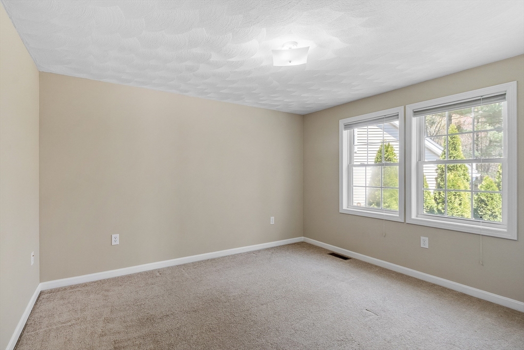 107 Charant Road Lowell, MA 01854 - Photo 17 of 30 an empty room with a window