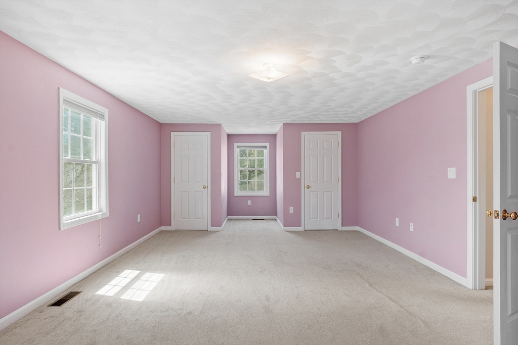 107 Charant Road Lowell, MA 01854 - Photo 18 of 30 an empty room with windows