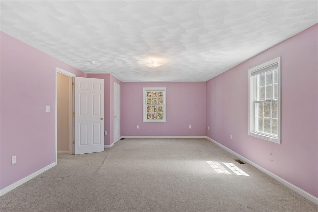 107 Charant Road Lowell, MA 01854 - Photo 19 of 30 an empty room with windows