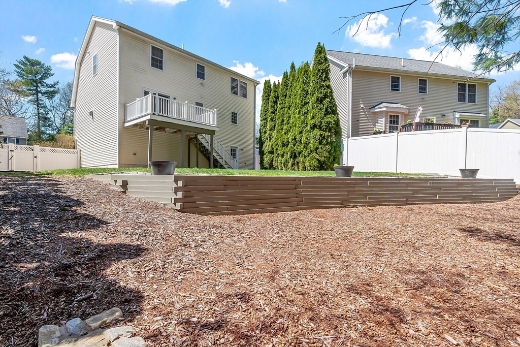 107 Charant Road Lowell, MA 01854 - Photo 25 of 30 a front view of a house with a yard