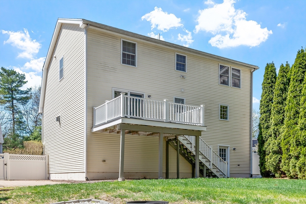 107 Charant Road Lowell, MA 01854 - Photo 29 of 30 a view of a house with a yard