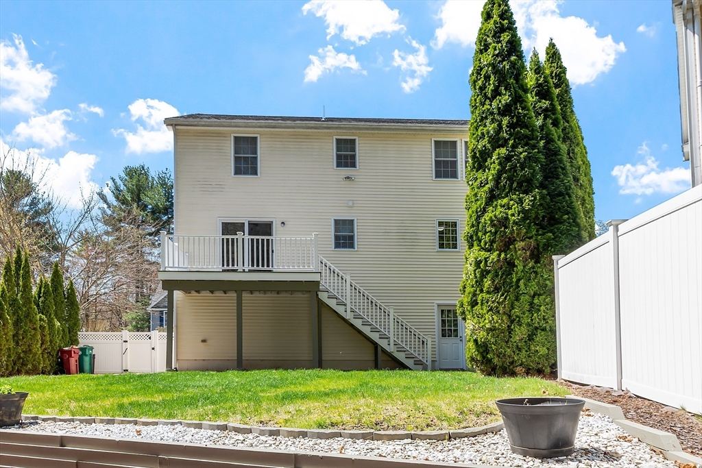 107 Charant Road Lowell, MA 01854 - Photo 30 of 30 a view of a house with a yard