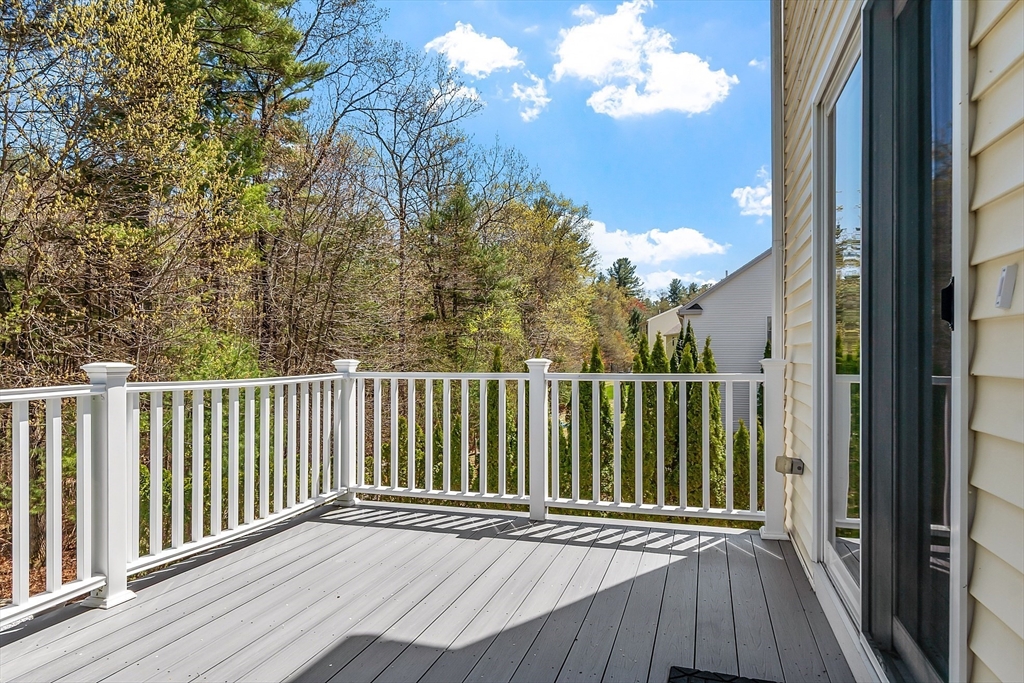 107 Charant Road Lowell, MA 01854 - Photo 6 of 30 a view of a balcony with wooden floor