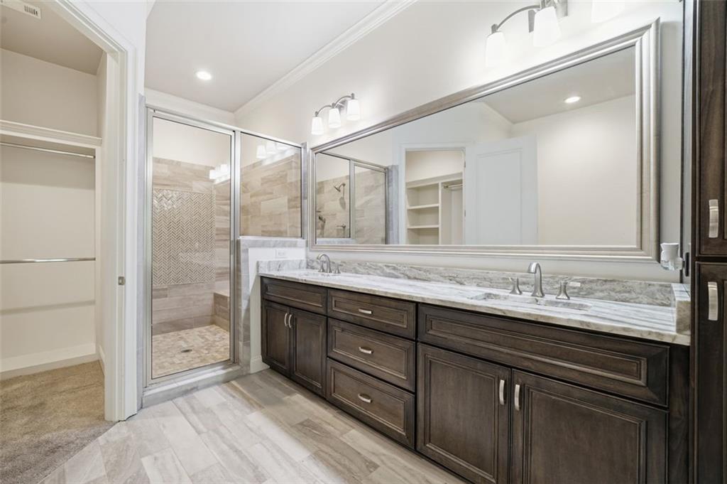 337 Rosshandler Road Suwanee, GA 30024 - Photo 24 of 45 a bathroom with a granite countertop sink mirror and double