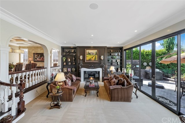 3 Harbor Island Newport Beach, CA 92660 - Photo 19 of 73 The remodeled living room features a grand fireplace, new sliding patio doors to bring the outdoors in.