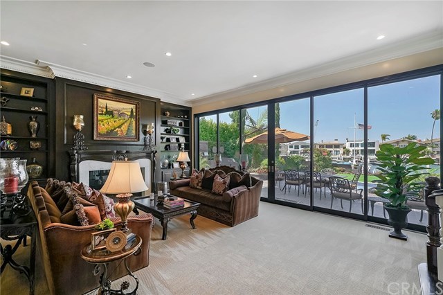 3 Harbor Island Newport Beach, CA 92660 - Photo 21 of 73 The spacious living room opens to the patio, pool and spa, grass and garden and a dock that can accommodate up to a 65ft vessel.