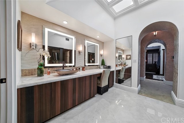 3 Harbor Island Newport Beach, CA 92660 - Photo 41 of 73 Second master suite bathroom, dressing area was remodeled just weeks ago, with an Onyx counter, locking jewelry drawers, and television in the mirror.