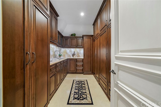 3 Harbor Island Newport Beach, CA 92660 - Photo 52 of 73 Upstairs storage room features room for electronic components, a wet bar/utility sink and custom cabinetry.