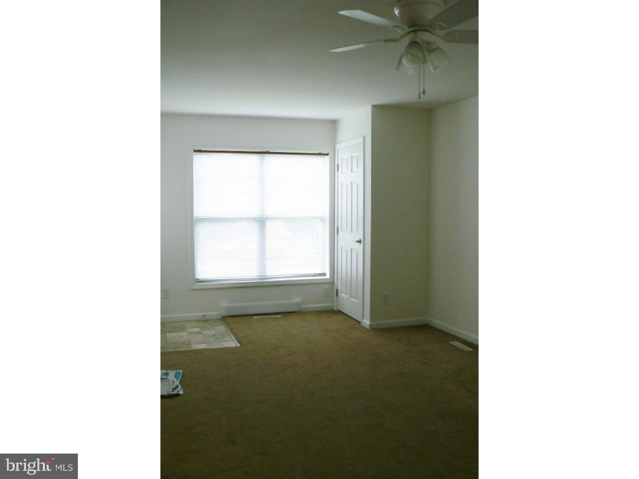 226 Pine Street Dover, DE 19901 - Photo 10 of 20 a open kitchen with white walls and a window