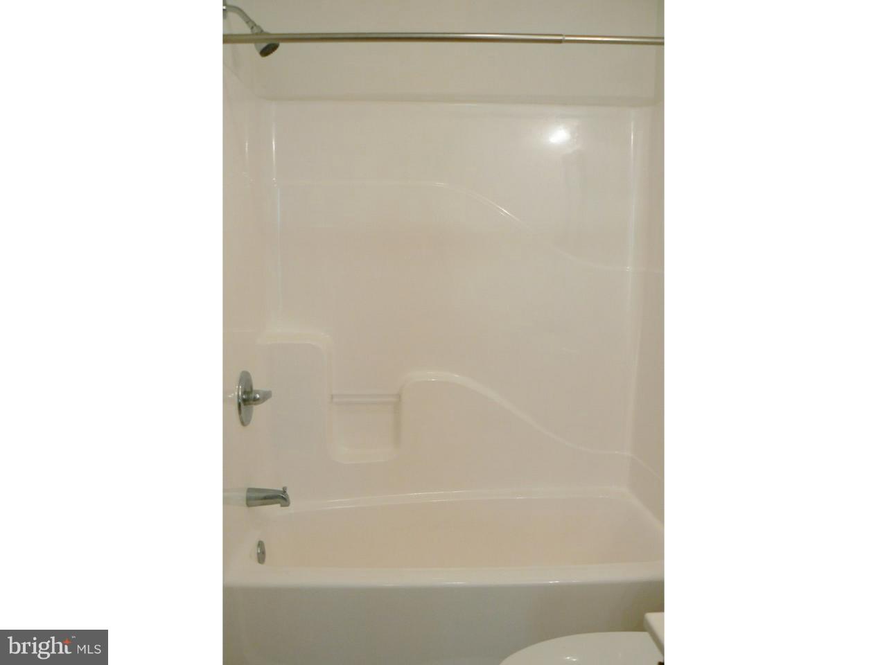 226 Pine Street Dover, DE 19901 - Photo 13 of 20 a bathroom with a bathtub and a shower