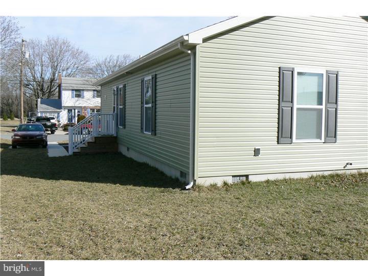 226 Pine Street Dover, DE 19901 - Photo 4 of 20 a front view of a house with a yard
