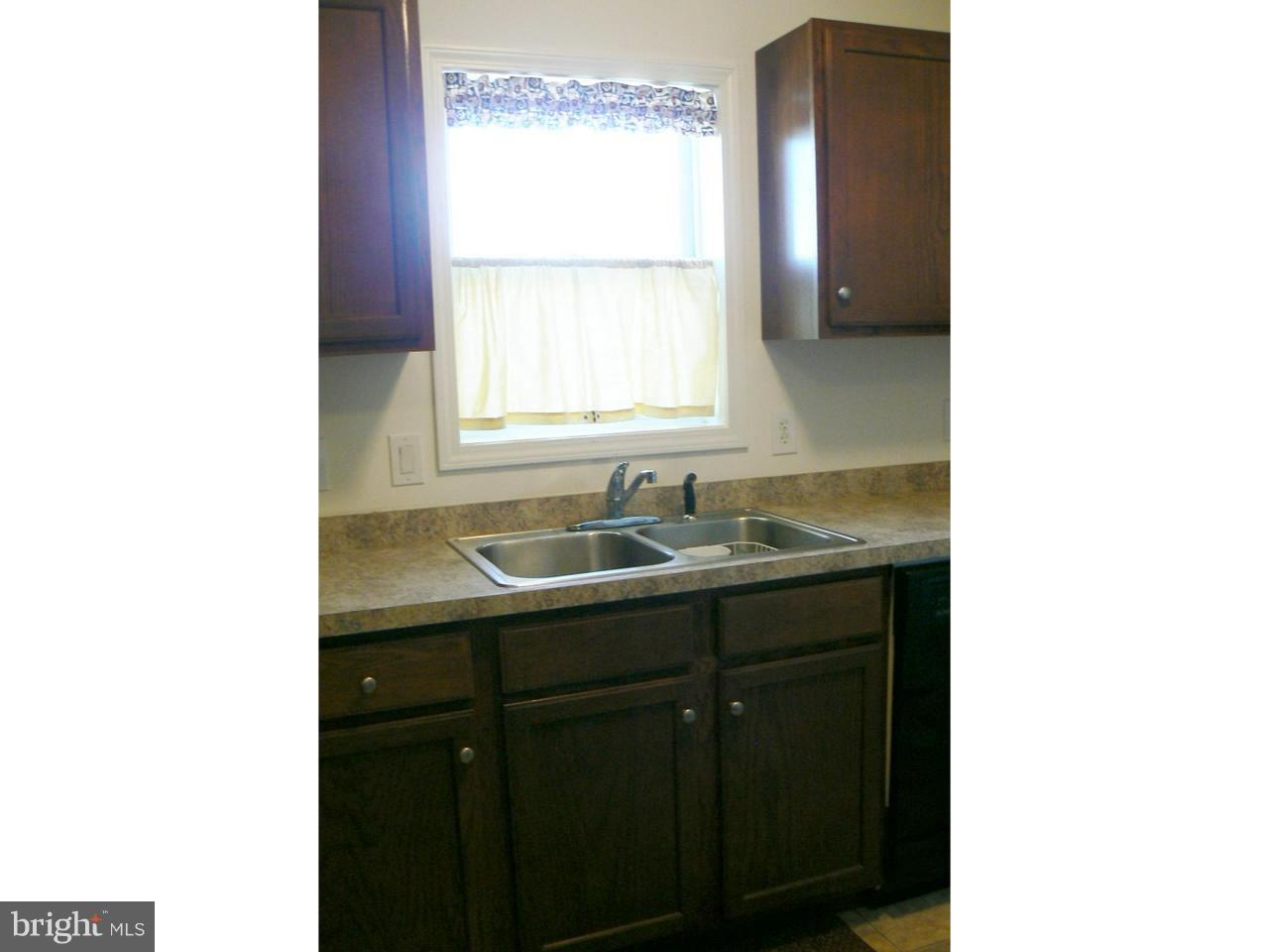 226 Pine Street Dover, DE 19901 - Photo 6 of 20 a bathroom with a sink and a vanity